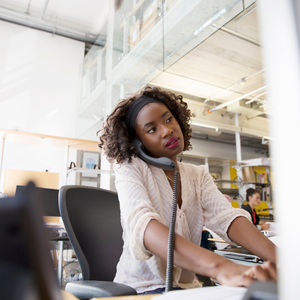 Woman in an office talking on the phone